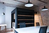 "Black Cube" contains bathroom and kitchen with sleeping loft on the top