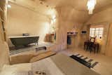 Located in converted caves in the Nazelles-Négron commune in France's Loire Valley, Amboise Troglodyte is a cozy, modern B&amp;B that has a tiled nook bath area.