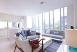 Decked out in plenty of white and cool grays and blues, this two-bedroom apartment sits in a luxury condominium in the heart of Singapore’s city center. Its floor-to-ceiling windows in the living room offer immersive views of the city.&nbsp;