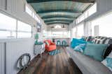 Located in a peaceful marina in downtown Charleston, South Carolina, this compact and cozy houseboat was gutted and refurbished with reclaimed materials and can house three people comfortably.