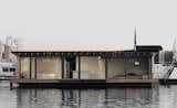 Moored in Lake Rummelsburg in Berlin, this 60-square-meter houseboat has full-height windows that open to views of the water and the city horizon. It has a large living area, open kitchen, and a fireplace—and can comfortably accommodate two adults and two children. &nbsp;&nbsp;