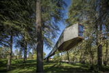 Part cabin, part tree house, and covered in slate and wood, Tree Snake House in Portugal’s Pedras Salgadas Park was designed by architect Luís Rebelo de Andrade and has windows that offer prime views of the forest and the starlit sky.