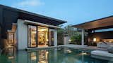 Outdoor, Large Pools, Tubs, Shower, Swimming Pools, Tubs, Shower, Infinity Pools, Tubs, Shower, Back Yard, Trees, Hardscapes, Shrubs, and Concrete Patio, Porch, Deck  Photos from A Modern Bali Resort That’s Inspired by the Local Landscape and Culture