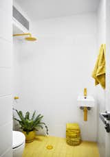 Bath Room, Ceramic Tile Floor, Wall Mount Sink, Open Shower, and Ceramic Tile Wall  Photo 8 of 12 in An Architect Turns His Victorian Home Into a Sun-Drenched Live/Work Space