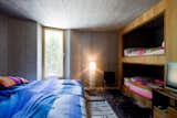 Kids, Bed, Bunks, Bedroom, Teen, Pre-Teen, Neutral, Chair, Lamps, and Rug  Kids Neutral Pre-Teen Bed Bunks Photos from Stay in a Swiss Vacation Home That's Literally Inside a Mountain