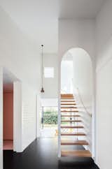 This stairway gets a very on-trend arch treatment.