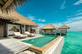 The 1,152 square feet overwater villas at this resort have wide doors that open to a terrace with a plunge pool facing the turquoise lagoon and their own private jetties.