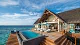 Outdoor, Wood Patio, Porch, Deck, Infinity Pools, Tubs, Shower, and Plunge Pools, Tubs, Shower Sited within 44 acres of Unesco World Biosphere Reserve in the Baa Atoll, the thatched water villas at this resort are designed with floor to ceiling windows for panoramic ocean views.  Search “부천오피{OPGO44.net}『『뜨밤』』부천오피 부천스파 부천업소 부천OP 부천오피 부천풀싸롱 부천kiss” from 9 Modern Maldivian Resorts With Spectacular Overwater Villas