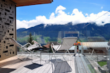 Situated in the alpine village of Vignongn, with views of the Val Lumneziz (Vally of Light), this eco-friendly, Scandi-inspired vacation home has a sunny terrace where you can enjoy views.  Photo 6 of 8 in 7 Alpine Holiday Chalets in Switzerland You Can Rent Now