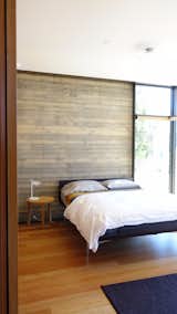 Bedroom, Bed, Night Stands, and Medium Hardwood Floor  Photo 1 of 7 in Take Your Next Vacation in a Midcentury Home in the Santa Monica Mountains