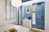 Bedroom, Dresser, Pendant Lighting, Light Hardwood Floor, and Bed  Photo 2 of 11 in A Smart Layout Maximizes Space in This Compact Urban Beach Apartment in Barcelona