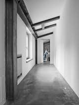 Hallway and Concrete Floor  Photo 19 of 25 in vacation by Molly E. Osler, Interior Design from Stay in a Modern, Industrial Home That’s Hidden Inside a Traditional Tuscan Villa