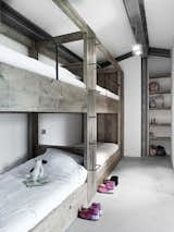 Kids, Bed, Concrete, Bedroom, Pre-Teen, Neutral, Shelves, and Bunks  Kids Bedroom Neutral Shelves Pre-Teen Photos from Stay in a Modern, Industrial Home That’s Hidden Inside a Traditional Tuscan Villa