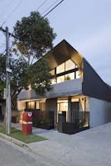 Outdoor, Front Yard, Trees, Grass, Small Patio, Porch, Deck, and Metal Fences, Wall  Photo 3 of 14 in Coppin Street Apartments by Dwell from What Looks Like a Single Dwelling in Melbourne Actually Holds Six Walk-Up Apartments