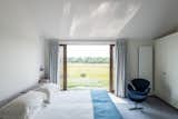 Bedroom, Chair, Wardrobe, and Bed  Photos from Explore a Prefabricated House For Sale in England That's Clad With Cor-Ten Steel