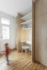 Storage Room, Closet Storage Type, and Shelves Storage Type  Photo 8 of 12 in workspaces by Jenam from A Family Apartment in Prague That’s Filled With Clever Storage Solutions and Built-In Nooks