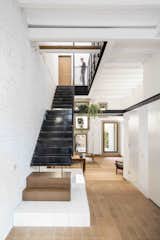 Staircase, Metal Tread, and Metal Railing  Photos from This Double-Height Apartment in 
 Barcelona Features Historic Details and a Floating Staircase