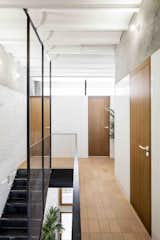 Staircase, Metal Railing, and Metal Tread  Photo 6 of 13 in La Diana by Dwell from This Double-Height Apartment in 
 Barcelona Features Historic Details and a Floating Staircase