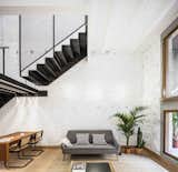 This Double-Height Apartment in 
 Barcelona Features Historic Details and a Floating Staircase - Photo 12 of 12 - 