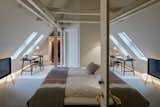 Bedroom and Bed Architecture and design firm Claesson Koivisto Rune transformed this Late Baroque villa into an 18-bedroom boutique hotel with painted wooden rafters and iconic mid-century furniture that's full of Nordic cool.  Photo 4 of 8 in 7 Stunning Scandinavian Hotels