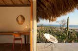 Architect Federico Rivera Rio updated traditional Oaxacan beach huts with palapa roofs, transforming it into stylish, minimalist bungalow hotel rooms with stucco walls, wooden floors and polished concrete bathrooms.