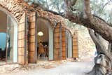 Nestled into an agricultural terrace in northeastern Spain, Casa Cova Blanca is an underground vacation home that draws in tons of light though its large, arched windows. The property is available for rent through Cool Stays.