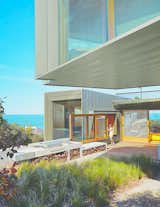Sited along the Great Ocean Road, this contemporary home in the village of Fairhaven was designed by architect John Wardle. Surrounded by Eucalyptus trees and facing the sea, the house’s kitchen leads to an outdoor deck and BBQ area that’s perfect for post-surf dinners.