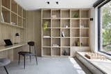 Office, Study Room Type, Library Room Type, Chair, Bookcase, Lamps, Shelves, Storage, and Desk  Photo 9 of 17 in A Remodel Turns a Dark and Choppy House in Melbourne Into a Bright, Flexible Family Home