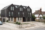 Located on the site of demolished old bungalows, Haddo Yard in Whitstable now consists of seven newly built apartments developed by Arrant Land and designed by celebrated UK practice Denizen Works. The building's facade has dark brick gables that echo the black timber sea fronts of fishing huts found in this part of Kent.&nbsp;