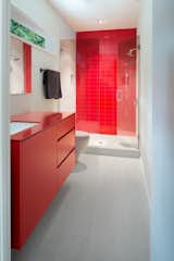 This red powder-coated Kohler option is ideal for storing toilet paper, toiletries, and other bathroom necessities out of sight.