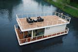 Based in the Czech Republic, No 1 Living builds houseboats with an upper and lower deck and glazed interiors that take advantage of outdoor views. Founded in 2013, they offer two models of houseboats: the No1 Living 40-foot model and the larger No1 Living 47-foot model. Both are equipped with a kitchen, full bathroom, bedrooms, and generous storage space. The houses are built with durable, anticorrosion-protected steel and polyethylene-segmented floats, which guarantee excellent floatation.&nbsp;