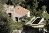 Exterior, Barn, Tile, Wood, Stone, House, and Farmhouse  Exterior Barn Stone Photos from An Abandoned Stable in Spain Is Transformed Into a Sustainable Vacation Home For Rent