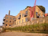 Exterior, Apartment Building Type, Gable RoofLine, and Brick Siding Material  Photo 2 of 12 in An Old Grain Warehouse on the River Thames Is Transformed Into an Industrial-Modern Home