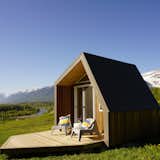 Energy efficient yet able to withstand sub-zero temperatures, hail, rain, snow and hot summers, the tiny eco cabins from Canadian firm The Little Cabin Company offer highly insulated standard 12 by 11.3 feet structures with cedar sidings, external power socket, a small front deck and low voltage recessed lights, with interiors that can be customized to fit up to four people. The fully constructed cabins will be delivered on site.  Photo 6 of 7 in 7 Companies That Can Help You Make Your Eco Pod