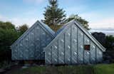 Futuristic yet traditional, this little prefab holiday retreat  in the western coast of Scotland makes a bold mark using zinc and plywood.