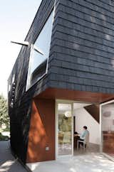 In Buffalo, New York, architect Adam Sokol designed "Birdhouse," a house with a black facade composed of shingles made out of locally recycled rubber.
