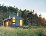 Writer and journalist Bruce Porter’s off-the-grid getaway on an island off the Maine coast was designed by his architect daughter, who happens to be the founder of her own practice called Alex Scott Porter Design. Sited close to the water, it has a screen porch that's angled to capture direct southern exposure for the solar panels.