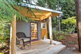 This prefabricated studio shed by Modern-Shed Inc. in Vahon Island, Washington, serves as a peaceful creative workspace for a professional artist.