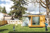 Portland-based architects Heidi Beebe and Doug Skidmore designed a glass-walled studio in the backyard of this house in Boise, Idaho, to act as a home office for one of the owners.