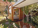 A 1950s Joseph Esherick home in Berkeley was updated by its owners in 2009 to include a new Japanese-inspired pavilion composed of two prefabricated, off-center rectangular volumes beneath a butterfly roof half clad with solar panels.  Photo 6 of 8 in 7 Coolest California Prefabs
