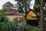 This 1930s black timber shed near the town of Eichgraben in Austria was converted by Vienna practice Franz &amp; Sue into a writing studio, playhouse, and guest room. It's accessed through a trapdoor, with a fully glazed gable that looks out to the treetops.&nbsp;