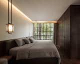 Bedroom, Pendant Lighting, Bed, Wardrobe, Night Stands, and Dark Hardwood Floor  Photo 7 of 14 in master bedroom & ensuite . VillaNova {Montreal, QC} by Bn Gold from 102 Potted Olive Plants Cover the Facade of This Bangkok Home
