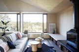 Living, Sofa, Wood Burning, Bench, Coffee Tables, End Tables, Rug, Recessed, and Concrete  Living Wood Burning Recessed Bench End Tables Rug Photos from A Bushland Home in Melbourne That's Divided Between Two Pavilions