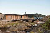 Exterior, House Building Type, Cabin Building Type, Flat RoofLine, and Green Roof Material  Photo 3 of 11 in A Norwegian Summer Cabin Embraces the Rocky Terrain