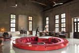 The hotel’s bar, which is sited where the sugar press once stood, was given a 1960s industrial makeover by Horizontal Space Design and includes a red circular lounge that's sunken into the middle of the space.
