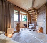 Living Room, Chair, Light Hardwood Floor, and Floor Lighting  Photo 9 of 12 in These Tree Houses in the Dolomites Look Like Egg-Shaped Pinecones