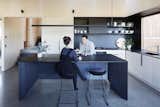 Kitchen, Open, Pendant, Wall, Range, Undermount, Concrete, Wall Oven, and Wood  Kitchen Concrete Wood Wall Pendant Photos from A Bushland Home in Melbourne That's Divided Between Two Pavilions