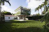 Exterior, Glass Siding Material, Concrete Siding Material, Flat RoofLine, and House Building Type  Photos from A Restaurateur's Mythical Home in Miami Follows the Path of the Sun