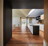 Kitchen, Concrete, Undermount, Medium Hardwood, Wood, Open, Range, and Mirror  Kitchen Medium Hardwood Mirror Open Photos from A New Hip Roof Rejuvenates a California-Style Bungalow in Melbourne