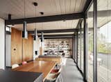 Living, Pendant, Shelves, Sofa, Chair, Rug, Wood Burning, Standard Layout, Floor, and Table  Living Floor Shelves Wood Burning Pendant Sofa Photos from See the Careful Transformation of a Midcentury Eichler in San Francisco